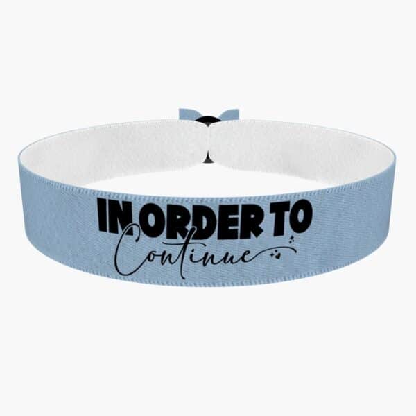 Ansicht von vorne: In order to continue Stoffarmband